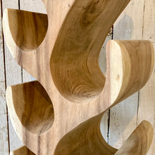 Load image into Gallery viewer, Close-up of 8 bottle Suar wood wine rack showcasing sapwood and heartwood