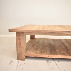 Square reclaimed teak coffee table, side view.
