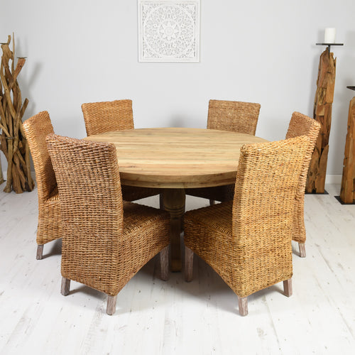 Round reclaimed teak dining set with 6 natural banana leaf chairs.