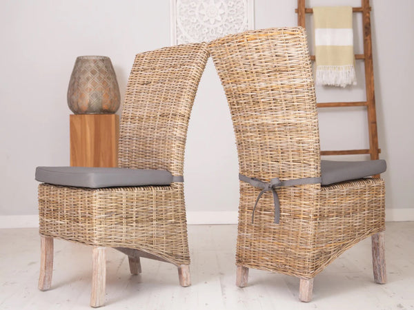Front and back view of natural Kubu rattan dining chairs, showcasing the woven texture and sturdy craftsmanship, available in natural and whitewash finishes at Rustic House.