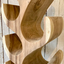 Load image into Gallery viewer, Close-up of 8 bottle Suar wood wine rack showcasing sapwood and heartwood