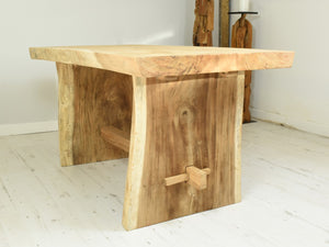 150cm Suar live edge dining table with pedestal style legs, side view.