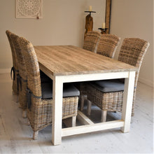 Load image into Gallery viewer, 200cm reclaimed pine &quot;Cottage&quot; style dining table featuring woodgrain table top and white painted legs, pictures with 6 natural Kubu wicker dining chairs with grey seat pad cushions