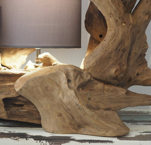 Natural teak root lamp base, close-up detail of rustic style wood lamp base.