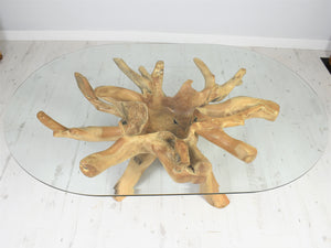 Teak root oval coffee table top view.