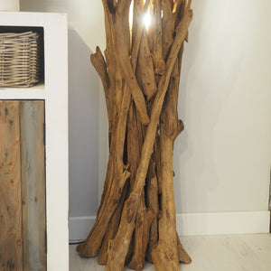 Detail of natural wood floor lamp base for cozy lighting