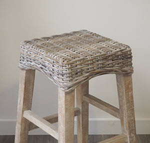 Sustainable whitewashed wooden kitchen stool with wooden frame and woven wicker seat.