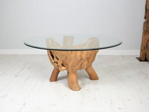 Round reclaimed teak root coffee table side view.