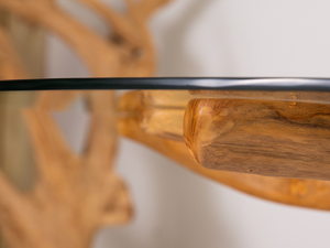 Close-up of the unique teak root base on oval dining table