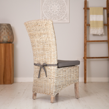 Load image into Gallery viewer, Back of whitewash wicker Kubu rattan dining chair showing the elegant sweeping back detail