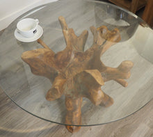 Load image into Gallery viewer, Round teak root coffee table view of glass top.