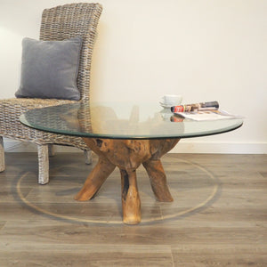 Round reclaimed teak root coffee table side view.
