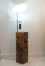 Load image into Gallery viewer, uplighter style floor lamp featuring a chunky wooden base crafted from naturally shaped pieces of teak wood cut as a square column.